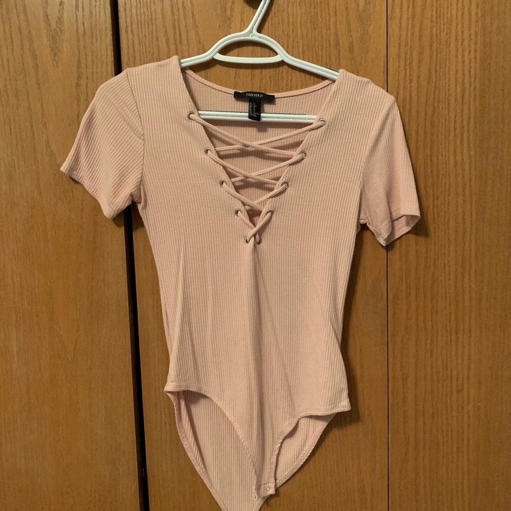 Pale pink body suit